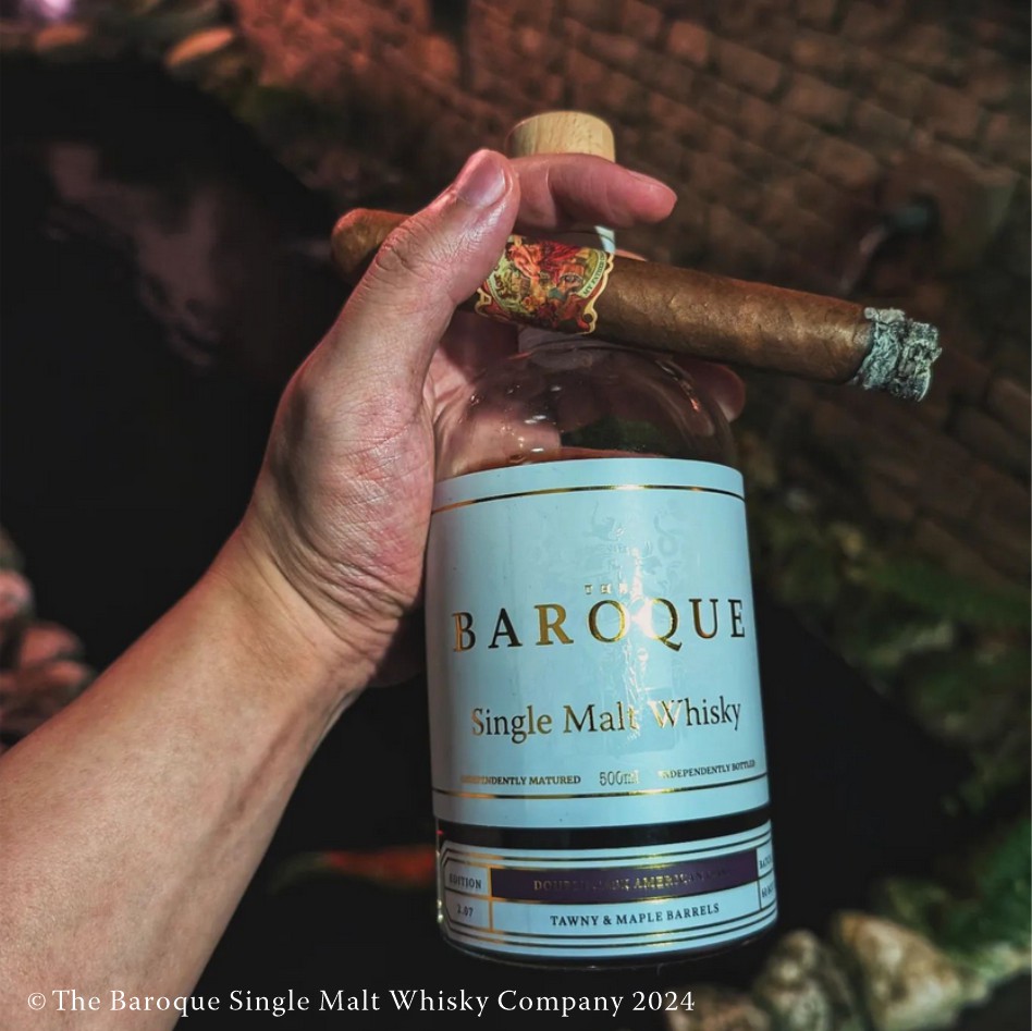 My Father Flor De Las Antillas cigar in hand with bottle of baroque single malt whisky pairing